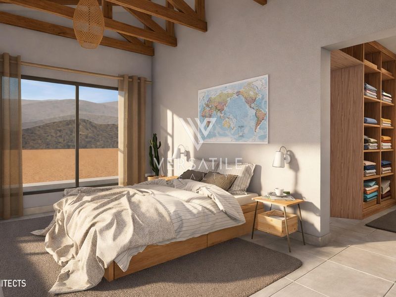 Spacious bedroom featuring exposed timber ceiling beams, tiled flooring, a large sliding glass door, and a convenient built-in wooden shelving unit.