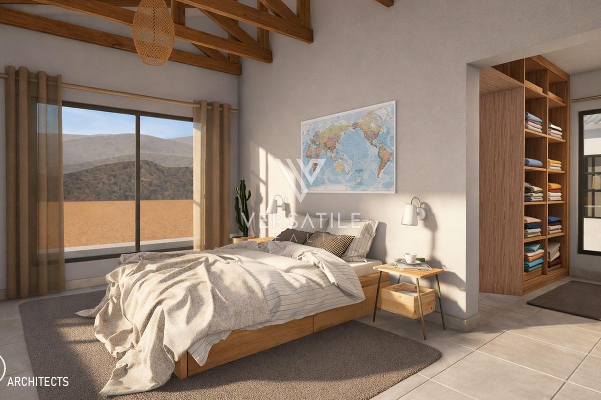 Spacious bedroom featuring exposed timber ceiling beams, tiled flooring, a large sliding glass door, and a convenient built-in wooden shelving unit.