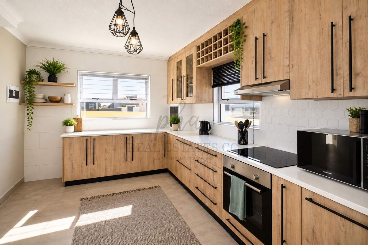 Modern kitchen featuring light wood-grain cabinetry, stone countertops, integrated appliances, and a stylish hexagonal tiled backsplash.