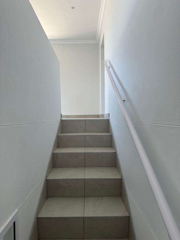 Stairs leading to upsatirs entertainment and living area