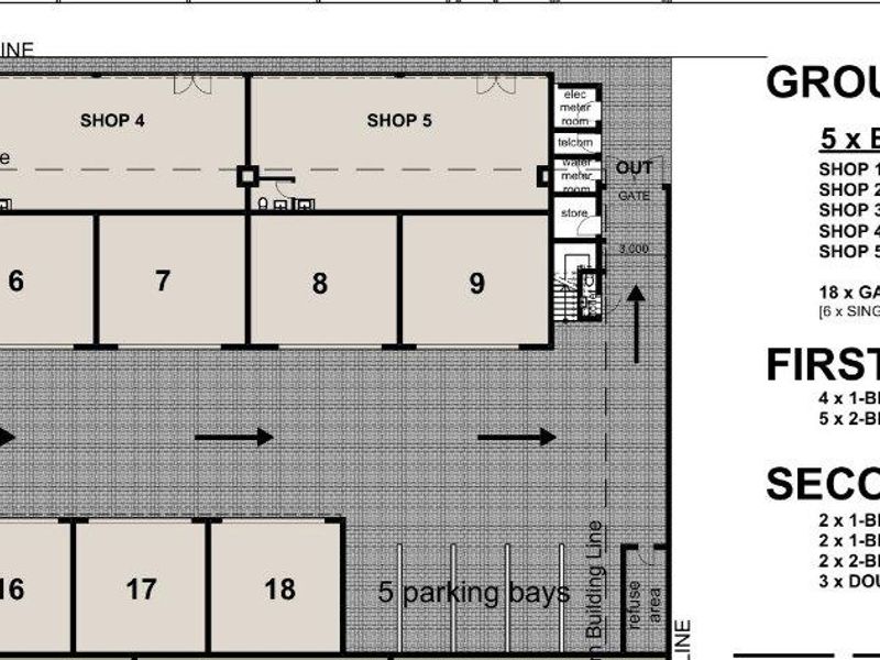 Architectural floor plan showing the ground floor layout, including five business shop spaces, eighteen garages, and designated parking bays for the apartment complex.