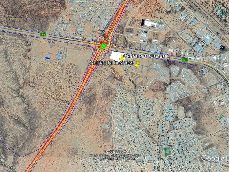 Aerial view of a commercial land parcel located near a major highway intersection in Okahandja.