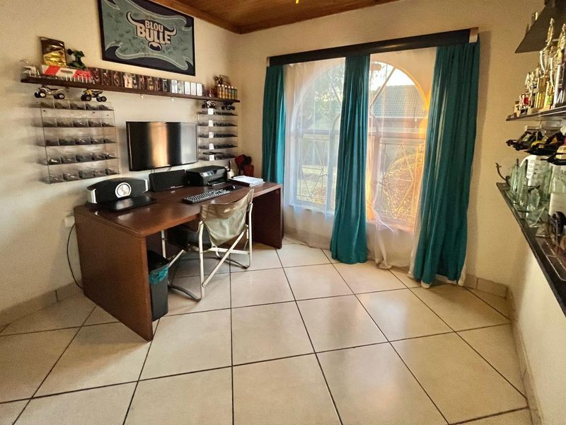 "Elegant Face Brick Home with Modern Security and Ample Parking! - Photo 7