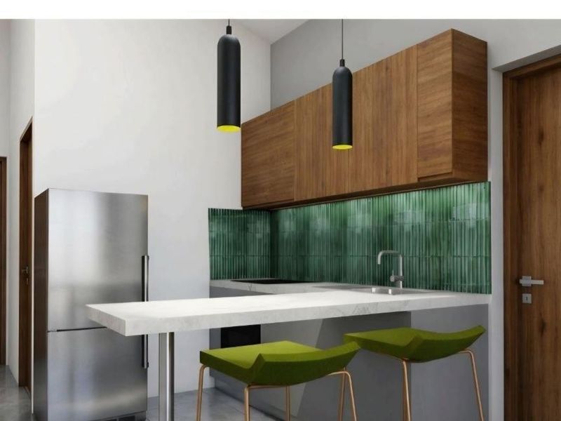 Modern kitchen featuring wood-finish cabinetry, a stone breakfast bar, green tiled backsplash, and contemporary pendant lighting.