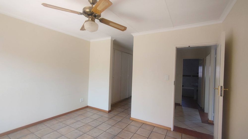 Main bedroom towards walk-in cupboards and en-suite bathroom