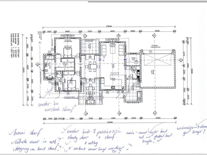 A detailed architectural floor plan showing the layout of a residential property including bedrooms, living areas, kitchen, and garage.