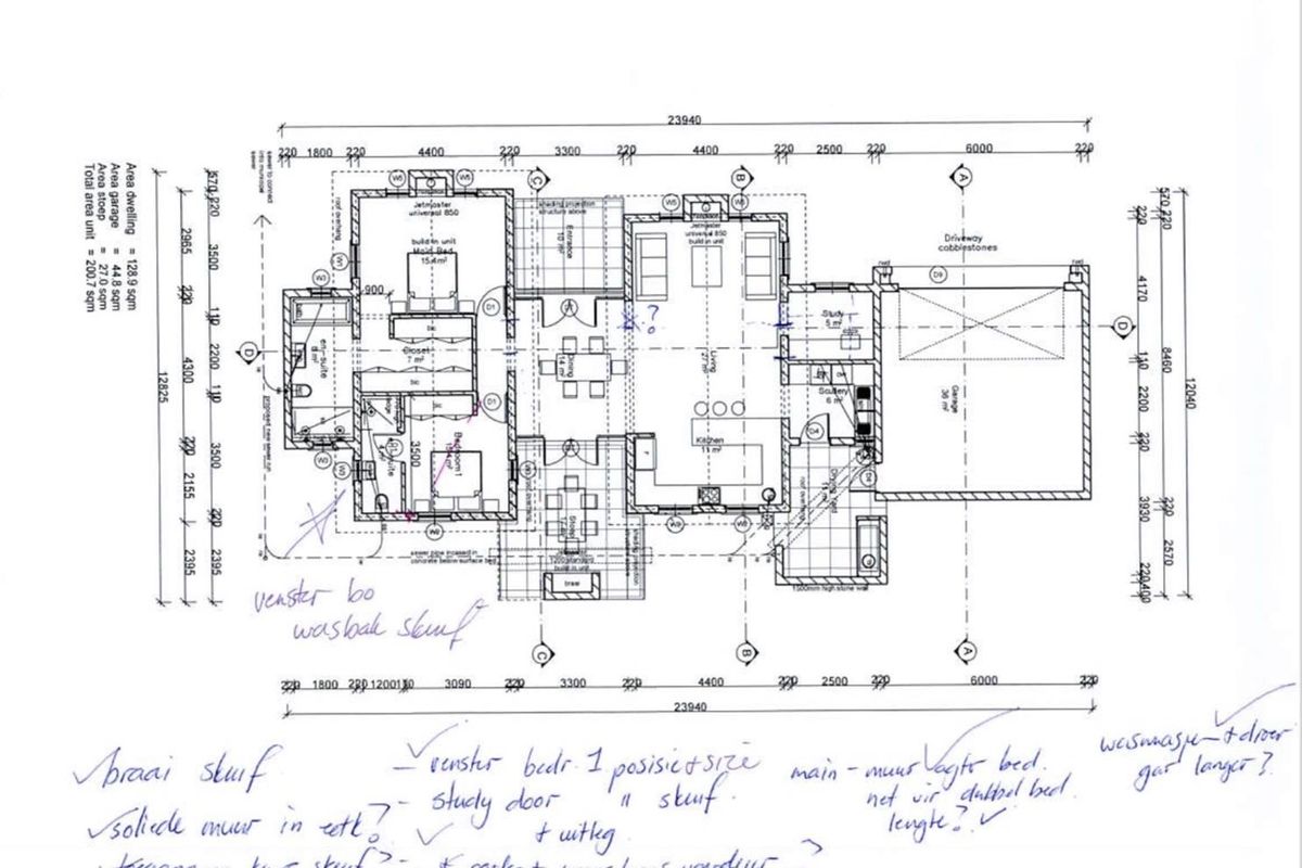 A detailed architectural floor plan showing the layout of a residential property including bedrooms, living areas, kitchen, and garage.