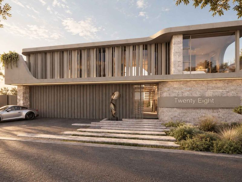 Modern architectural front elevation featuring stone cladding, vertical timber louvres, and a striking cantilevered concrete roof design.