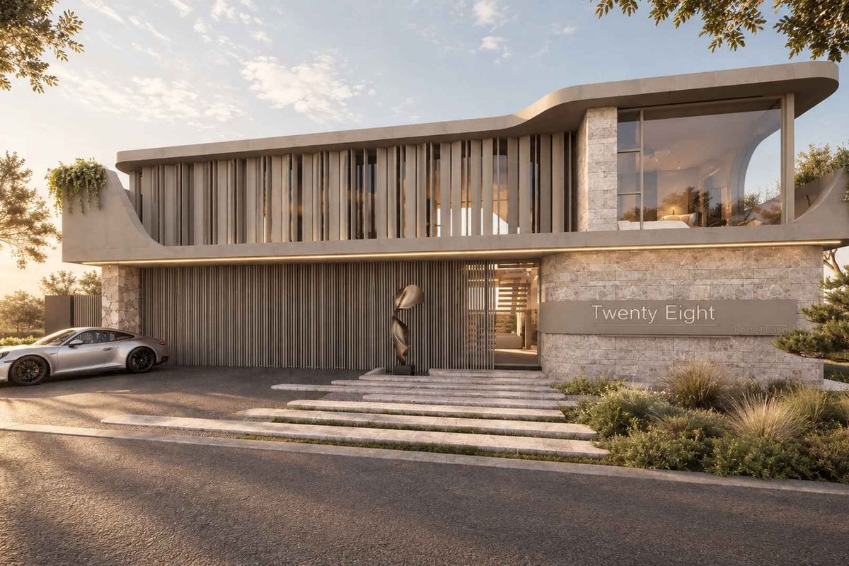 Modern architectural front elevation featuring stone cladding, vertical timber louvres, and a striking cantilevered concrete roof design.