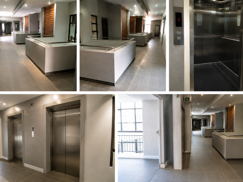 Modern apartment building hallway featuring tiled floors, recessed lighting, timber accents, and a stainless steel elevator access point.