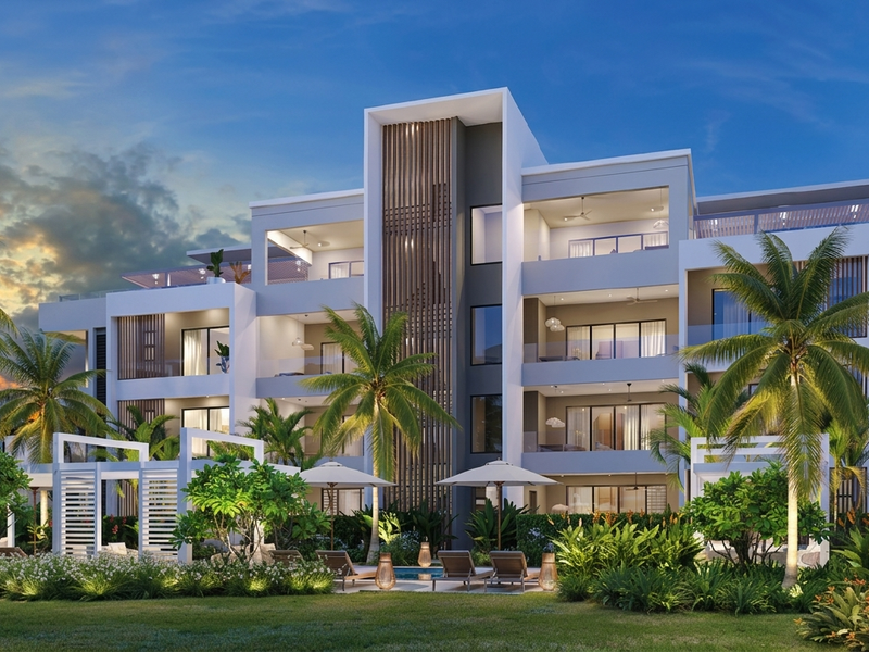 A modern apartment complex featuring multi-level balconies, contemporary architectural timber detailing, and lush landscaped grounds.