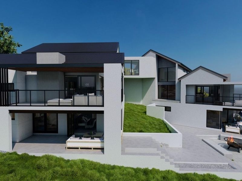 A modern architectural rear elevation featuring multi-level balconies, expansive glass doors, and a landscaped terrace overlooking the ocean.