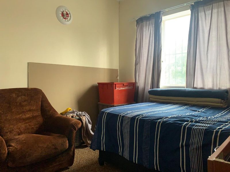 **Charming 3-Bedroom Home with Income Potential in a Tranquil Neighborhood** - Photo 7