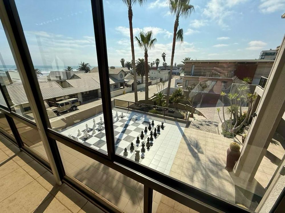 Enclosed balcony with BBQ and sea view. Man-sized chessboard on second floor