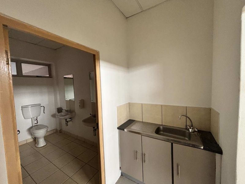 Neat Industrial Unit with Roller Door Access, Offices & Mezzanine Space - Photo 6