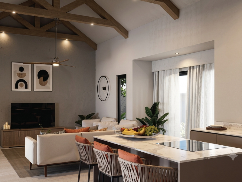 Spacious open-plan living area featuring exposed timber beams, a modern kitchen island with stone countertops, and integrated cooktop, creating a bright, contemporary atmosphere.