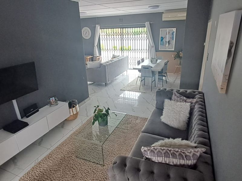 Step into this spacious and well-appointed 4-bedroom home, designed for comfortable family living and effortless entertaining. - Photo 2