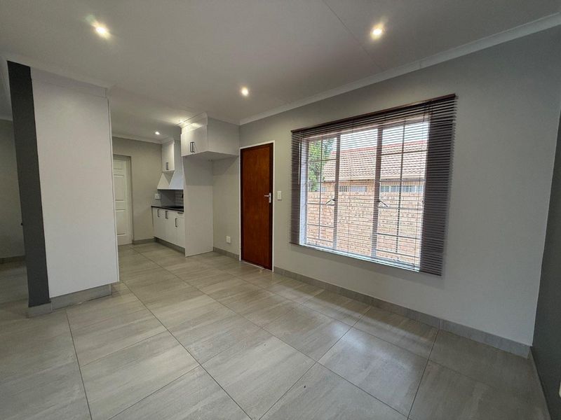 Stylishly Renovated Two-Bedroom Simplex with Double Garage and Garden - Photo 10