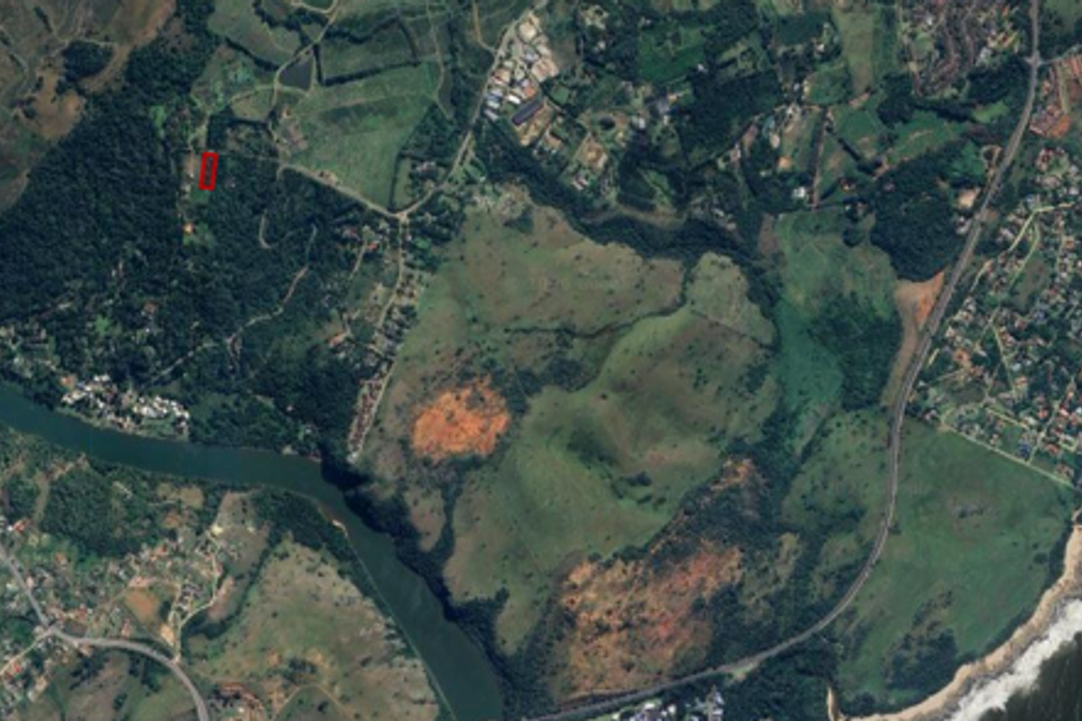 An aerial satellite view showing the residential land parcel in relation to the surrounding coastal landscape and natural terrain.