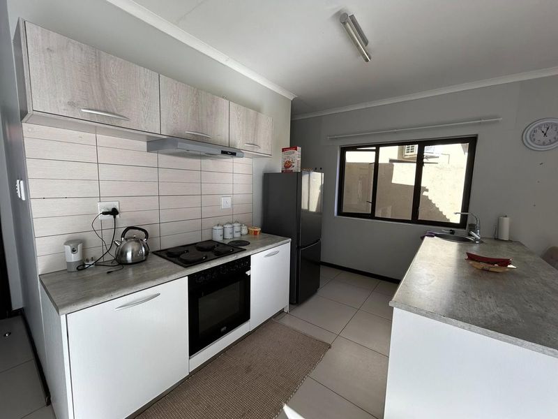 Discover this inviting 3-bedroom unit nestled in a secure gated community, offering comfort and space in a prime location. - Photo 4