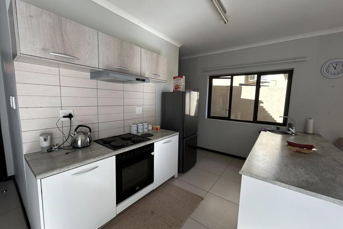 Discover this inviting 3-bedroom unit nestled in a secure gated community, offering comfort and space in a prime location. - Photo 4