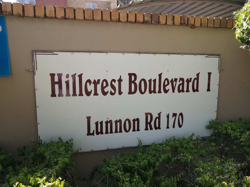 Exterior signage for Hillcrest Boulevard I located at 170 Lunnon Road, mounted on a boundary wall.