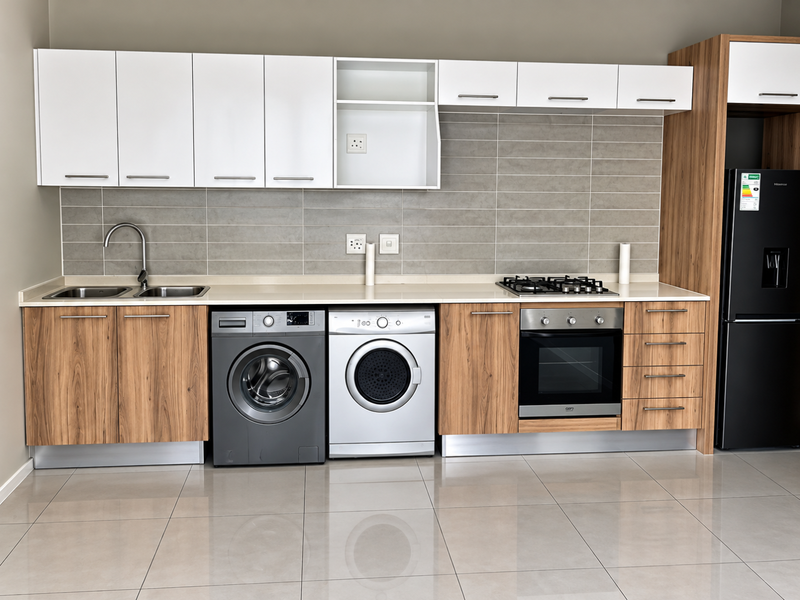 Modern kitchen featuring wood-grain and white cabinetry, stone countertops, integrated gas hob, built-in oven, and sleek tiled backsplash with polished floor tiles.