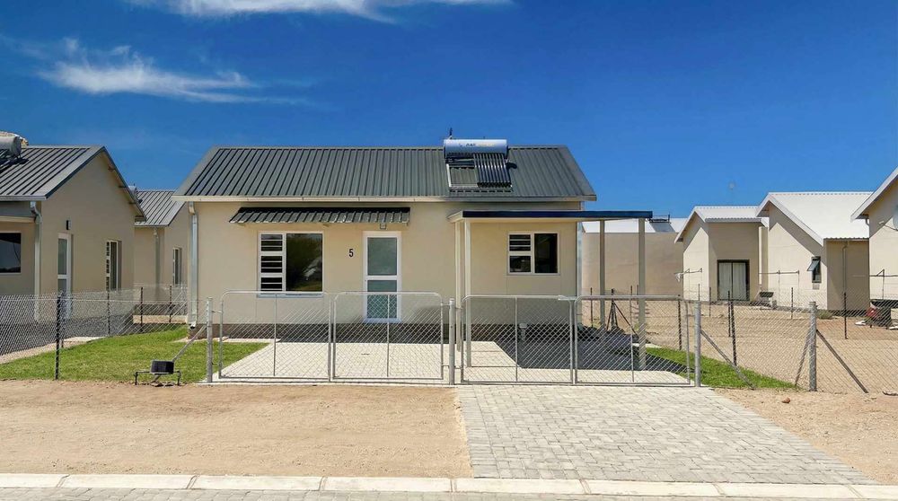 Freestanding townhouse with provision for future expansion and carport.