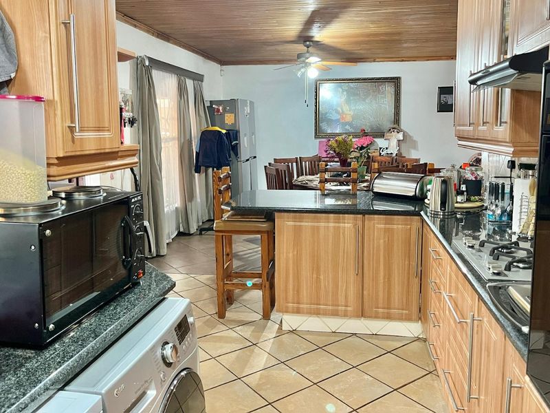 "Elegant Face Brick Home with Modern Security and Ample Parking! - Photo 4