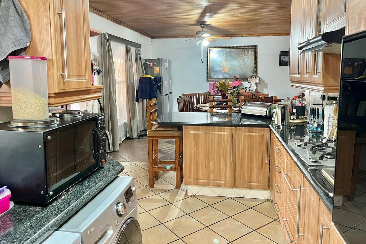 "Elegant Face Brick Home with Modern Security and Ample Parking! - Photo 4