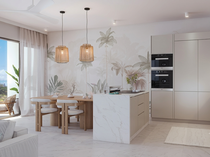 Modern open-plan kitchen and dining area featuring a marble island, built-in double oven, integrated cabinetry, and seamless access to a private balcony.