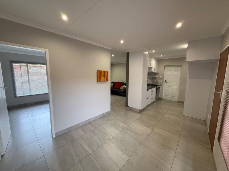 Stylishly Renovated Two-Bedroom Simplex with Double Garage and Garden - Photo 9