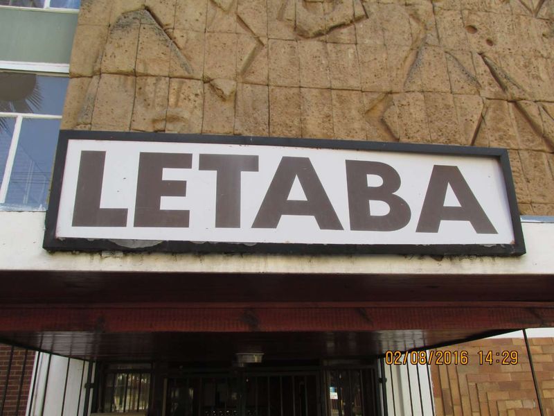 Exterior view of the building entrance featuring the Letaba signage mounted on a textured stone facade.