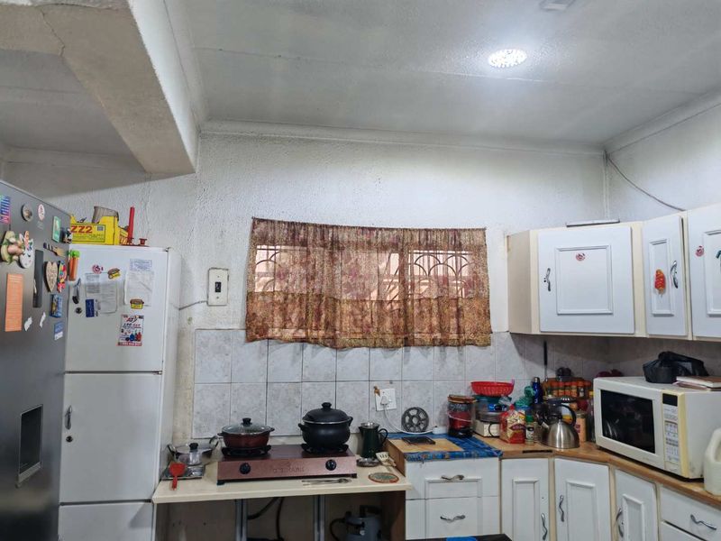 Spacious 4-Bedroom Home with Income-Generating Potential - Photo 7