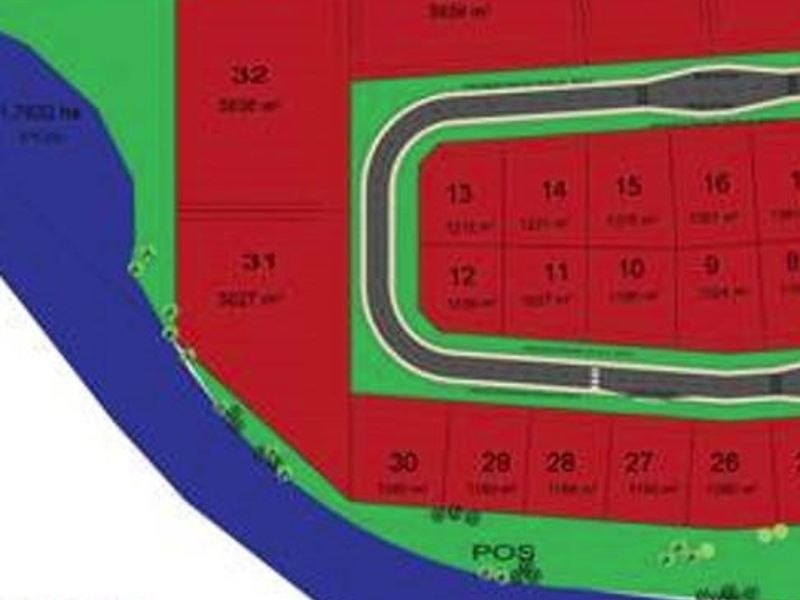A site development plan showing the layout and numbering of commercial land plots within the estate.