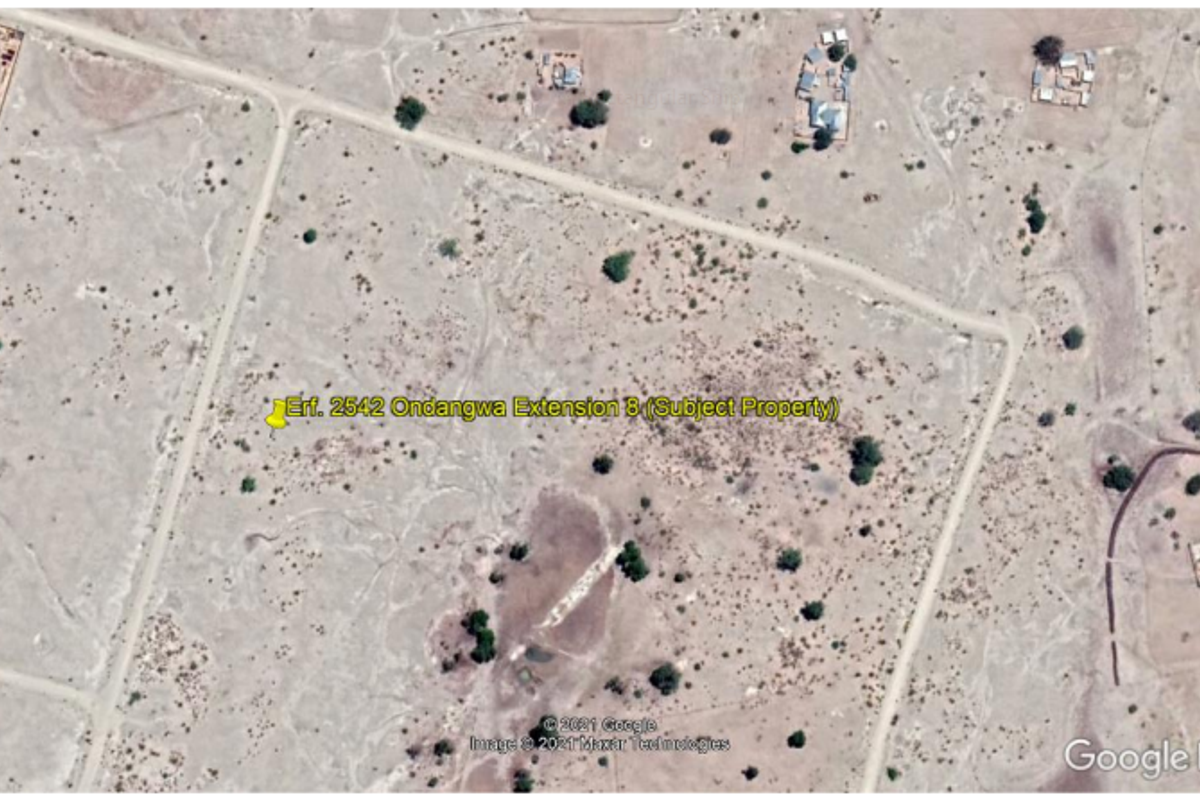 An aerial satellite view showing the location of Erf 2542 in Ondangwa Extension 8, featuring undeveloped land with surrounding road infrastructure.