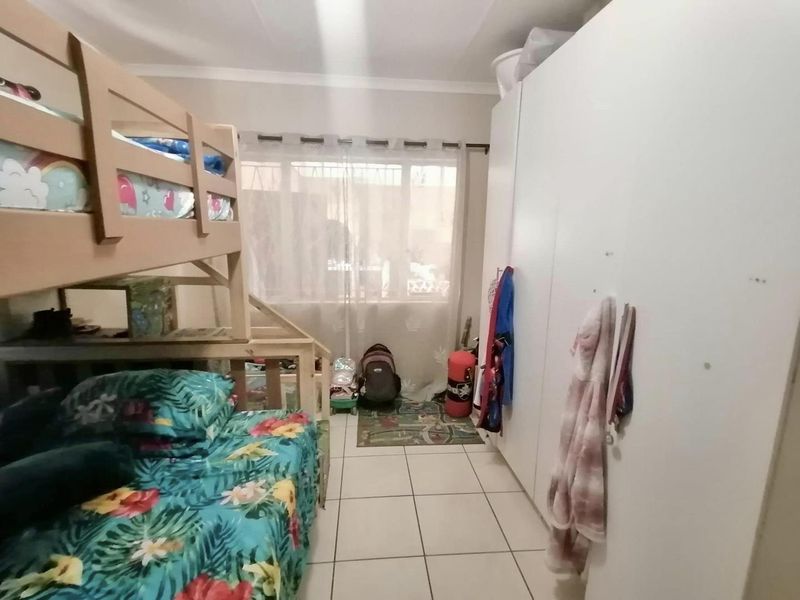 This charming 3-bedroom home offers spacious living areas, a modern kitchen, and a cozy backyard perfect for relaxation. - Photo 6