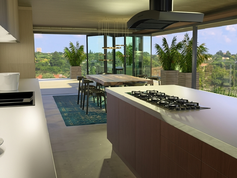 Modern open-plan kitchen and dining area featuring a central island with gas cooktop, sleek cabinetry, and expansive bi-fold doors opening to a scenic balcony.