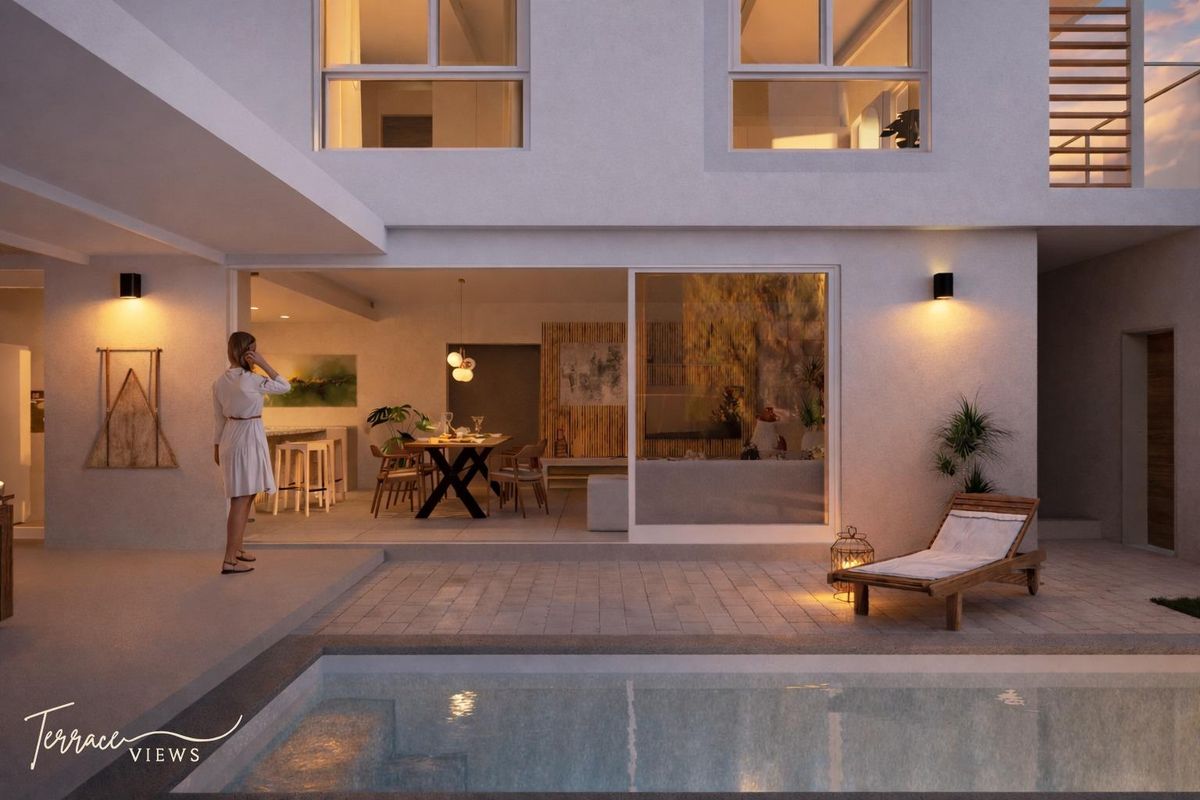 A modern townhouse exterior featuring a covered patio, swimming pool, and seamless indoor-outdoor flow through large sliding glass doors.