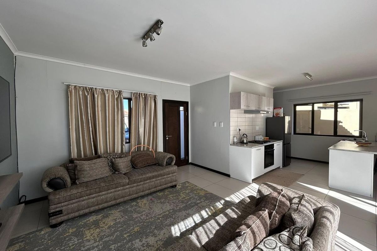 Discover this inviting 3-bedroom unit nestled in a secure gated community, offering comfort and space in a prime location. - Photo 2