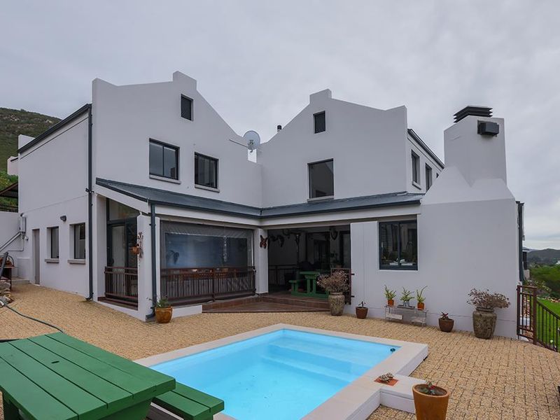 Stunning Family Home with Panoramic Mountain Views and Income-Generating Cottage - Photo 3