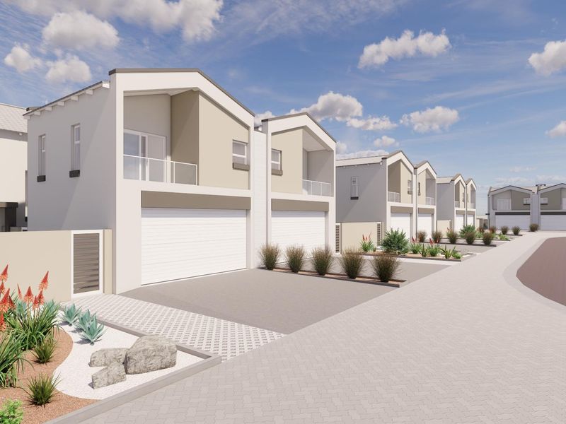 A perspective view of a modern townhouse development featuring paved driveways, integrated garages, and upper-level balconies.
