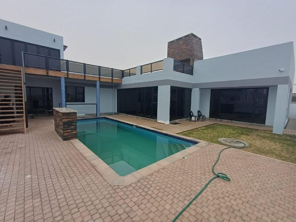 Yard with pool and upstairs outside BBQ