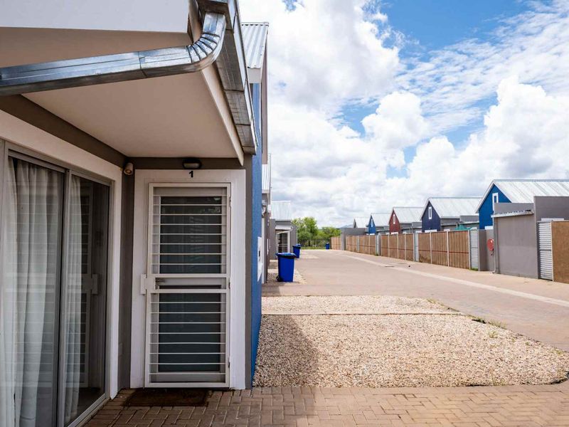 Rare Find! Spacious Single-Level Townhouse in Secure, Pet-Friendly Complex - Photo 6