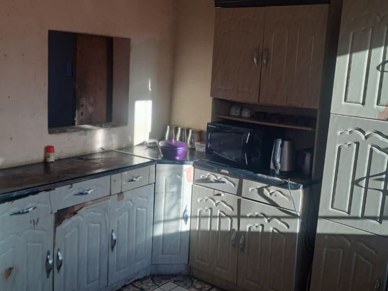 Peaceful 3-Bedroom Family Home with 2 Rondavels for Extra Income Potential - Photo 2