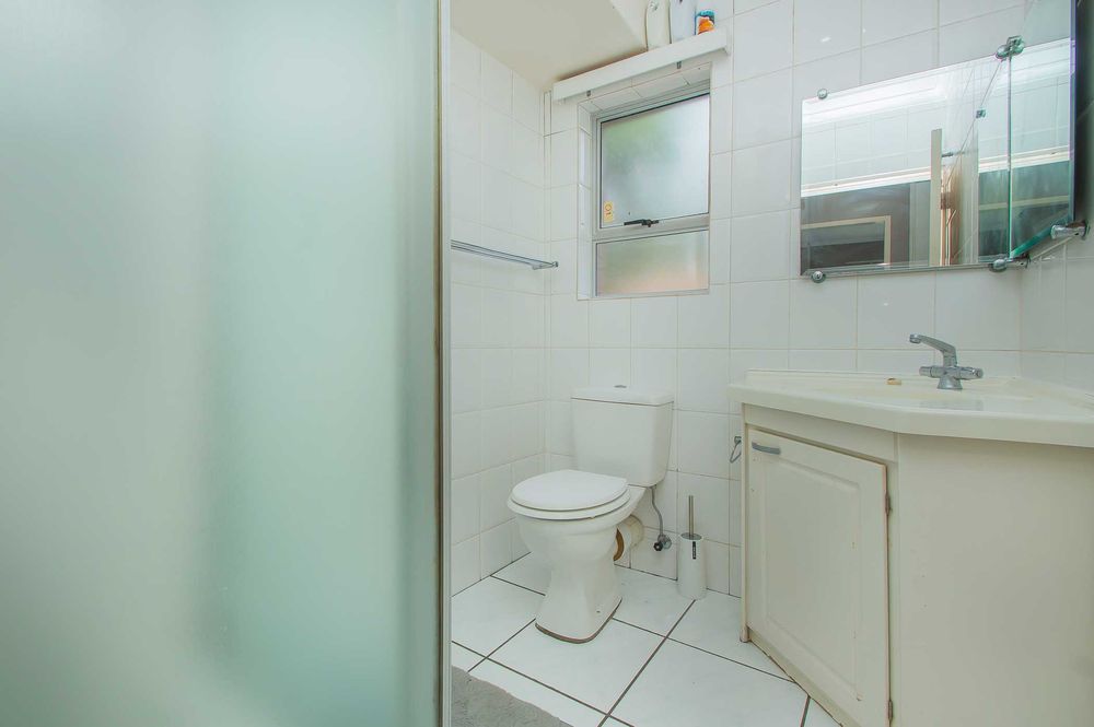 Family bathroom with shower in same finish s en-suite