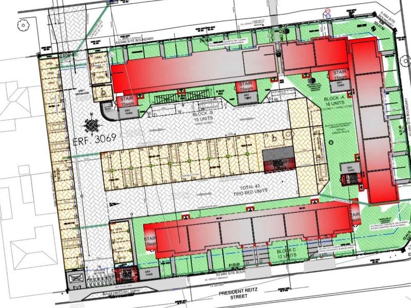 Architectural site plan showing the layout of three apartment blocks, parking areas, and site boundaries for the property development.