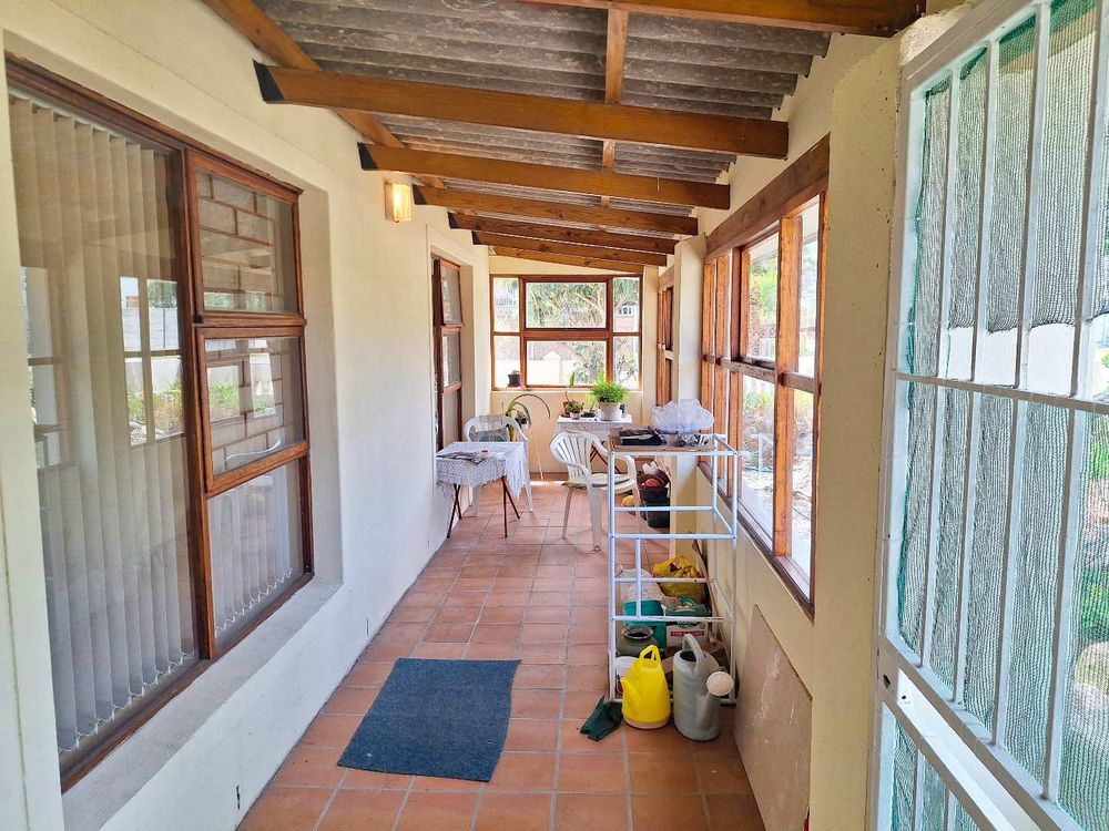 Enclosed sun room in front of house