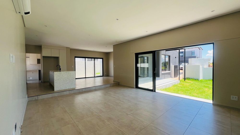 Open Plan Lounge /Dining /Kitchen with sliding doors to the back yard. 