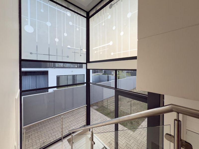 Modern Architectural Gem with Versatile Living & Expansive Balcony in Midstream Meadows - Photo 7